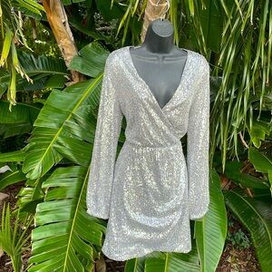 The drop silver sequin wrap dress